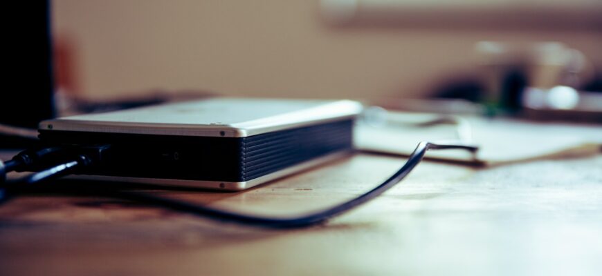 gray and black corded device on table