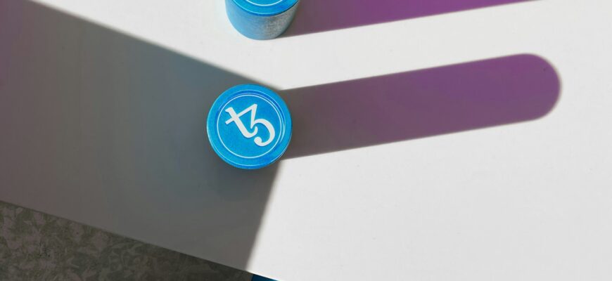 a couple of blue and purple markers sitting on top of a table