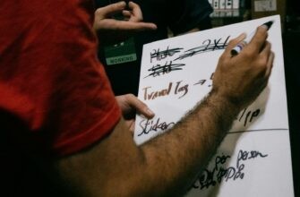 Someone is writing notes on a whiteboard.