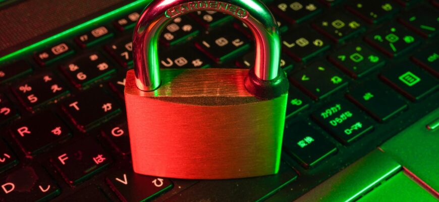 red padlock on black computer keyboard