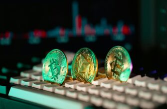 Cryptocurrency coins sit on a keyboard.