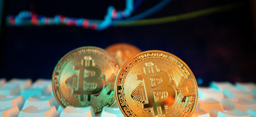 Bitcoin coins are displayed with a stock chart.