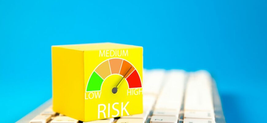 Yellow cube with risk meter on keyboard