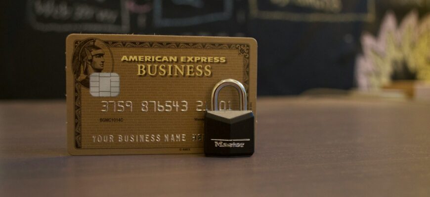 closeup photo of American Express Business card on brown surface