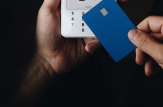 A person holding a credit card in their hand